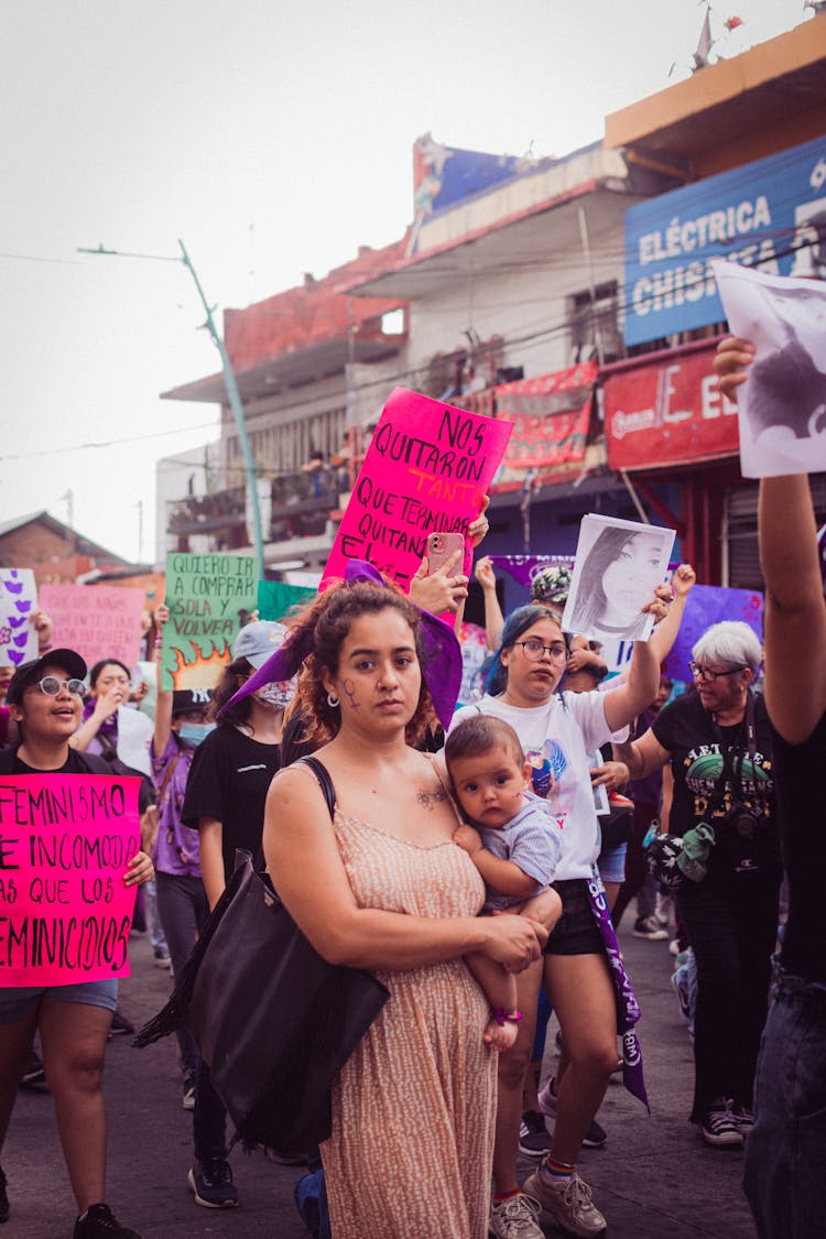 Woman With Child On Street Protest