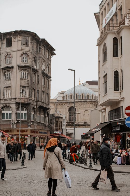 Free Lively street view in Istanbul featuring historic architecture and passerby. Stock Photo