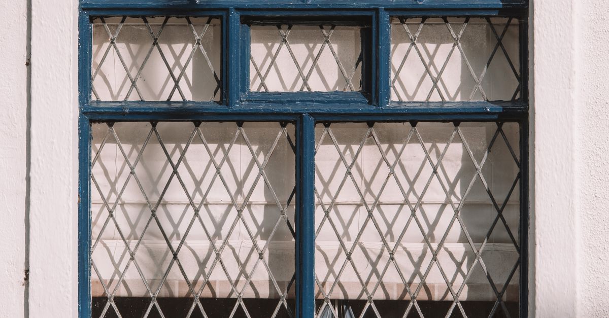 Window with Gates at House Wall · Free Stock Photo
