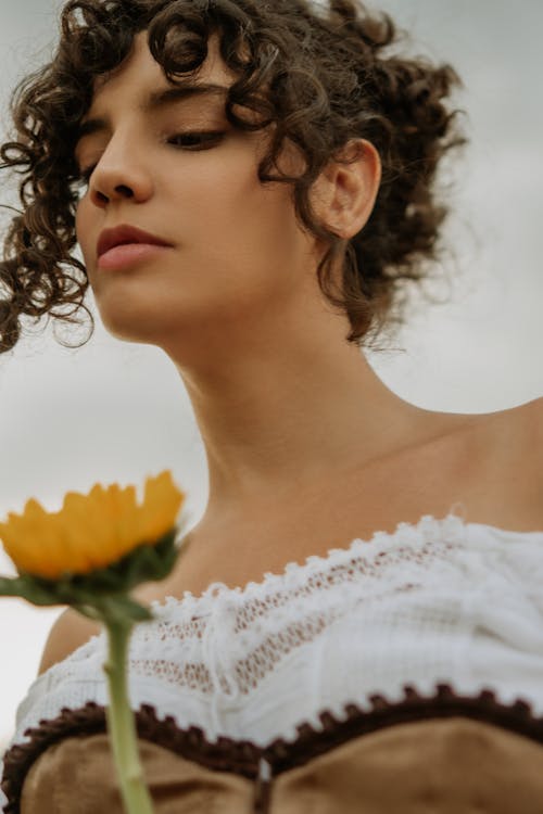 Beautiful Woman Holding Sunflower