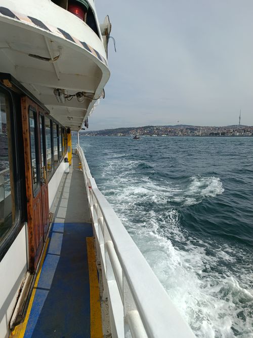 Free A passenger ferry sails in the Bosphorus Strait, capturing the scenic view of Üsküdar and Istanbul's urban landscape. Stock Photo