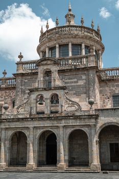 A detailed view of the historic Hospicio Cabañas under a clear blue sky in Guadalajara, Mexico.