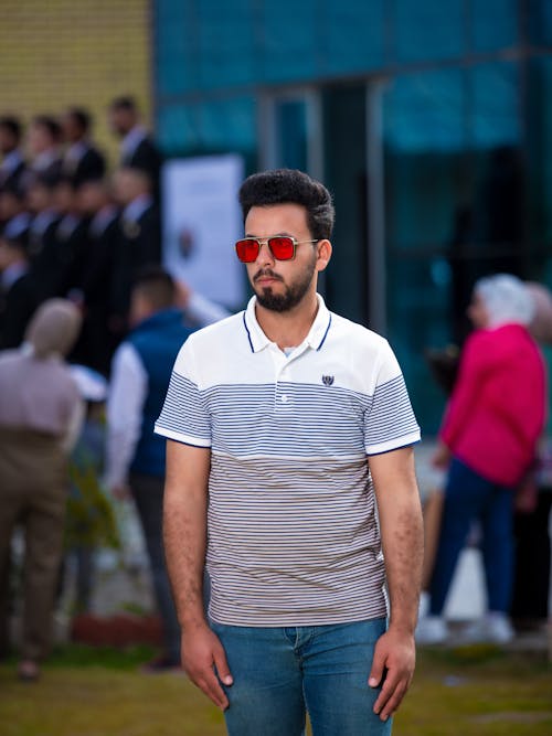 Bearded Man in Sunglasses Standing on City Street