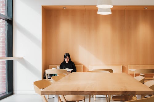 Free Young Woman Sitting in a Lobby Stock Photo