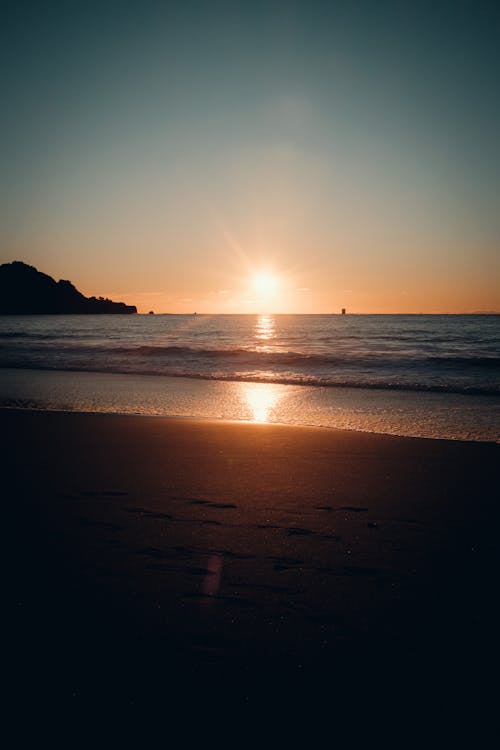 Sunset on Clear Sky over Sea Shore