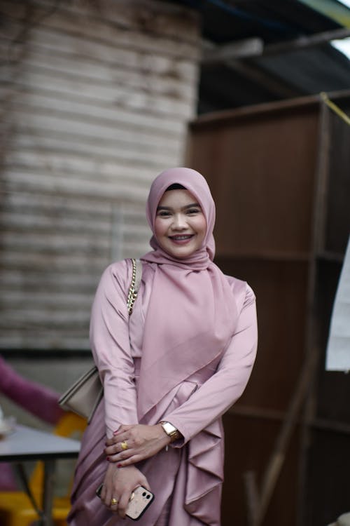Smiling Woman in Pink Clothes