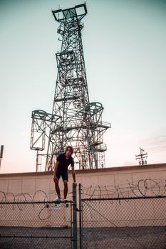 Person Standing on Steel Fence