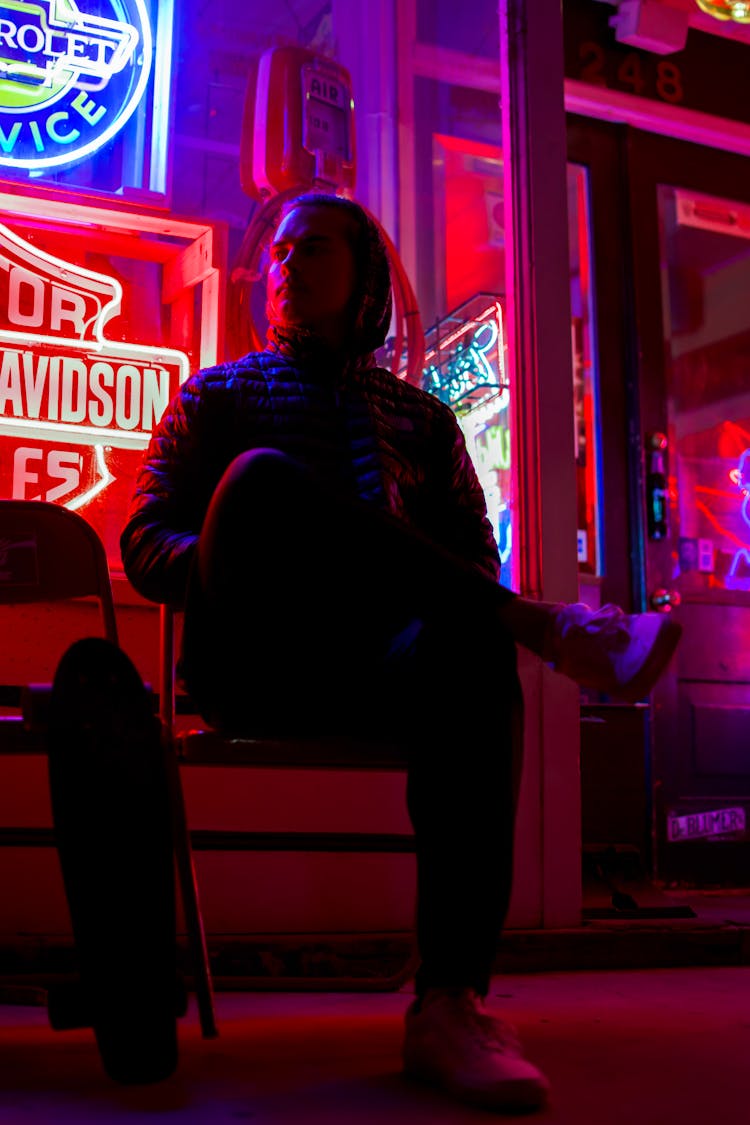 Man Sitting On Chair Cross Leg