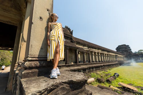 Woman Leaning against the Wall of the Angkor Wat, Siem Reap, Cambodia