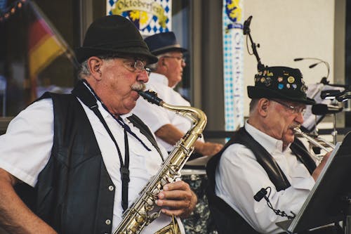 Three Men Playing Musical Instruments