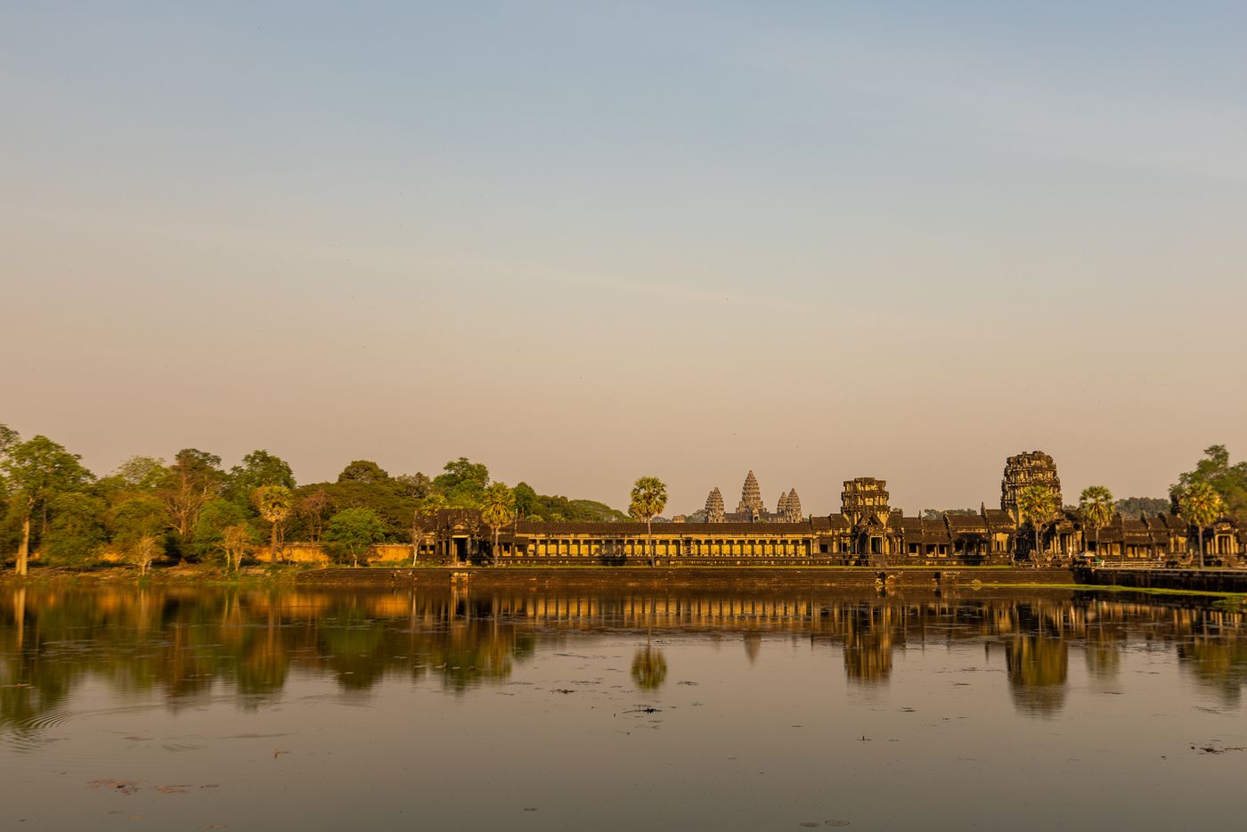 Angkor Wat reflected in water at sunrise, Cambodia