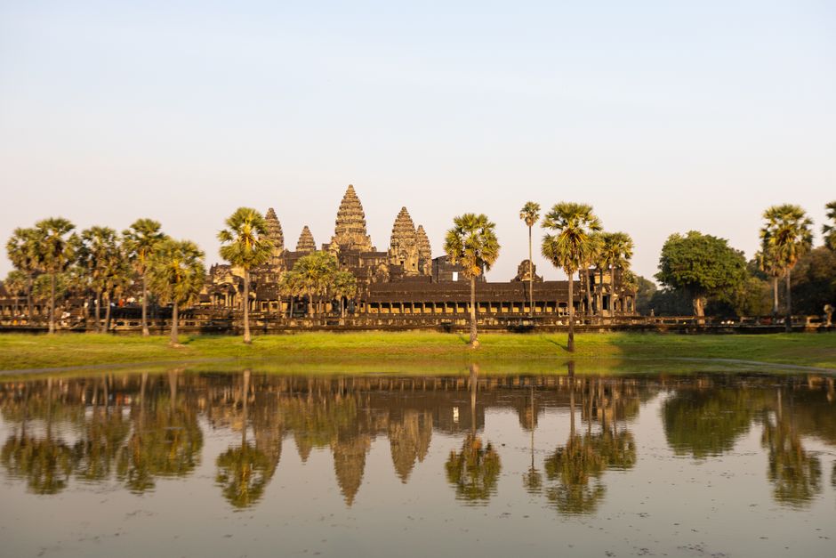 Angkor Wat temple under a clear blue sky in Cambodia's dry season