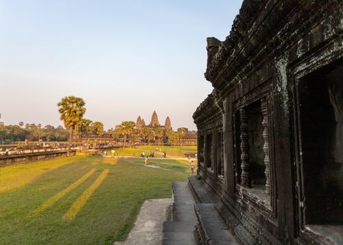 Free Sunset over the historic Angkor Wat temple complex, showcasing its architectural grandeur. Stock Photo