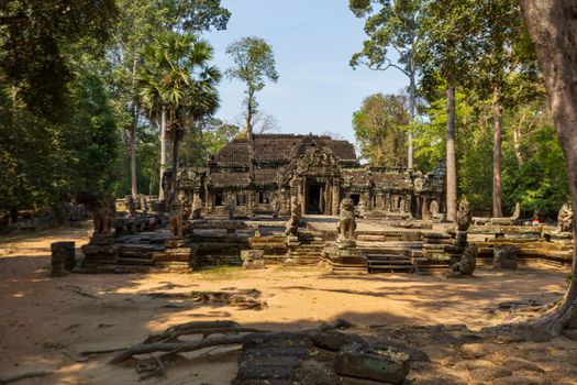 Explore the historic Angkor Wat temple nestled in Cambodia's lush forest, a masterpiece of ancient architecture.