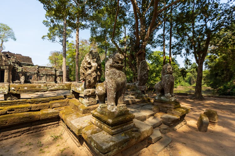 Statues In Front Of An Ancient Temple In Cambodia 