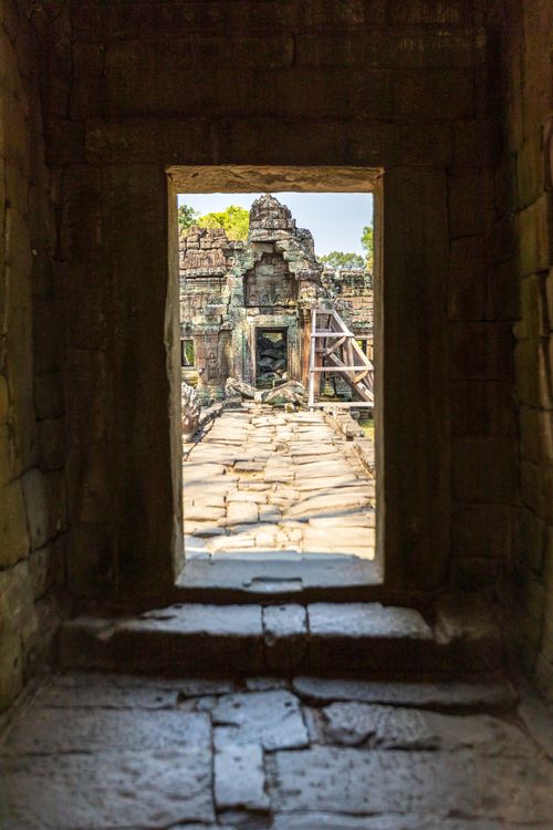 Free Explore the timeless beauty of ancient temple ruins through a weathered stone doorway, capturing history's essence. Stock Photo