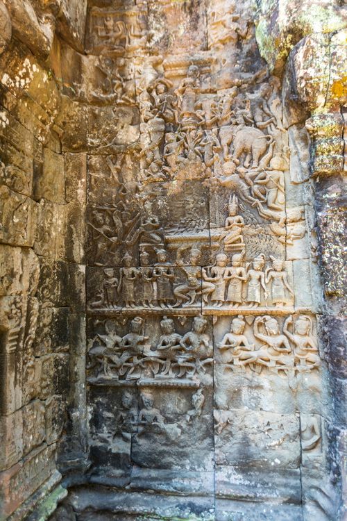 Free Detailed bas relief depicting ancient scenes at Ta Prohm temple in Cambodia. Stock Photo