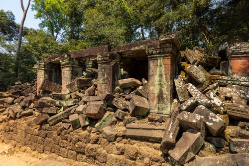 Free Explore the ancient ruins of Angkor Wat, Cambodia, showcasing historical architecture amidst lush greenery. Stock Photo