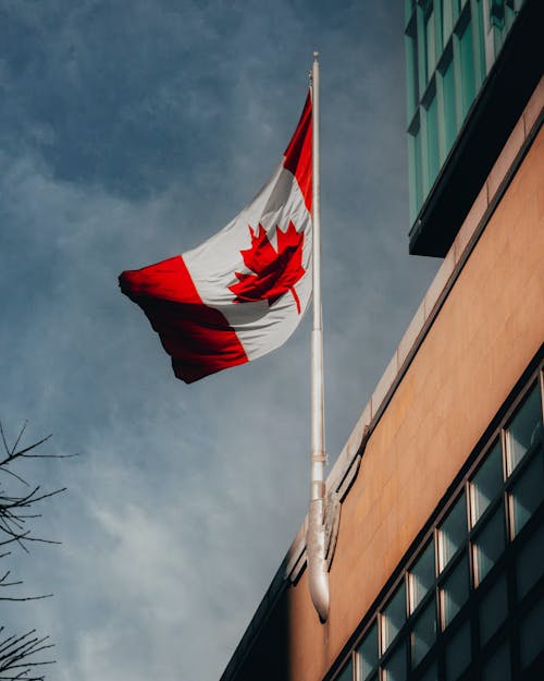 Photo of a Canadian Flag on a Building Facade