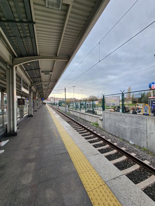Free A quiet railway station platform in Istanbul, capturing train tracks and station architecture. Stock Photo