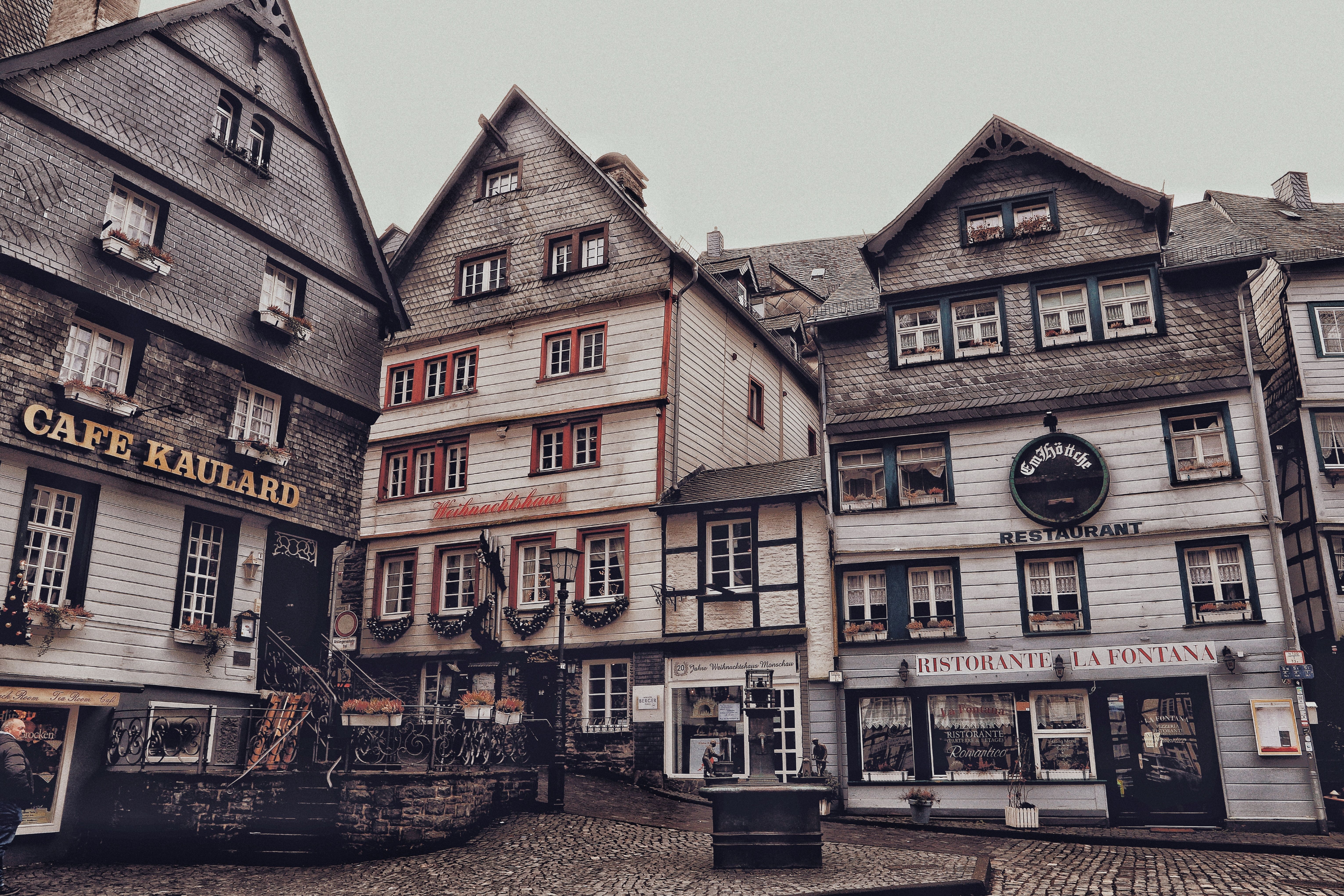 Vintage view of historic architecture in Monschau, Germany with quaint cafes and restaurants. - Monschau