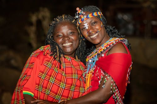 Photo of Two Happy Women in Traditional Masai Clothing