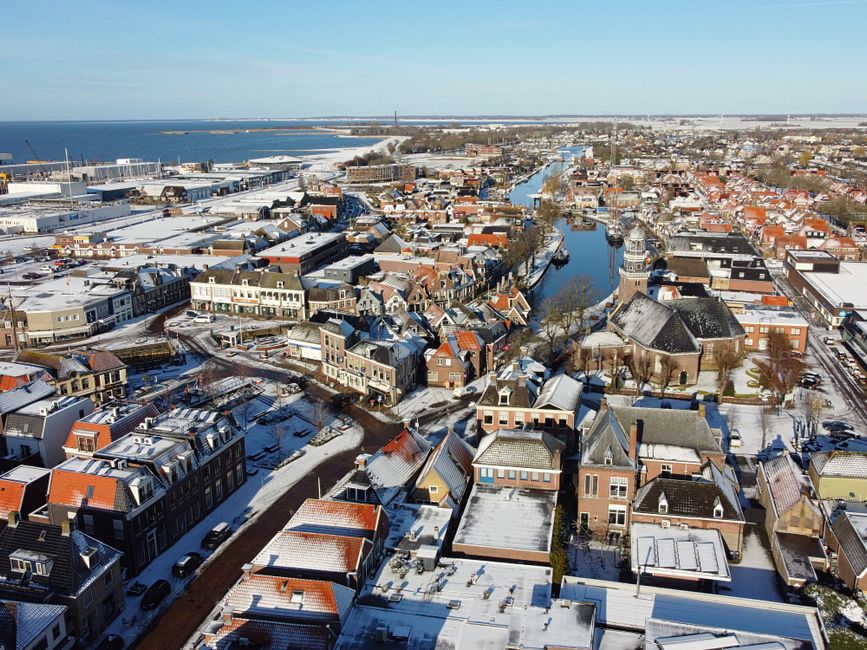 Snow-covered aerial view of the charming city of Lemmer in Friesland, Netherlands.