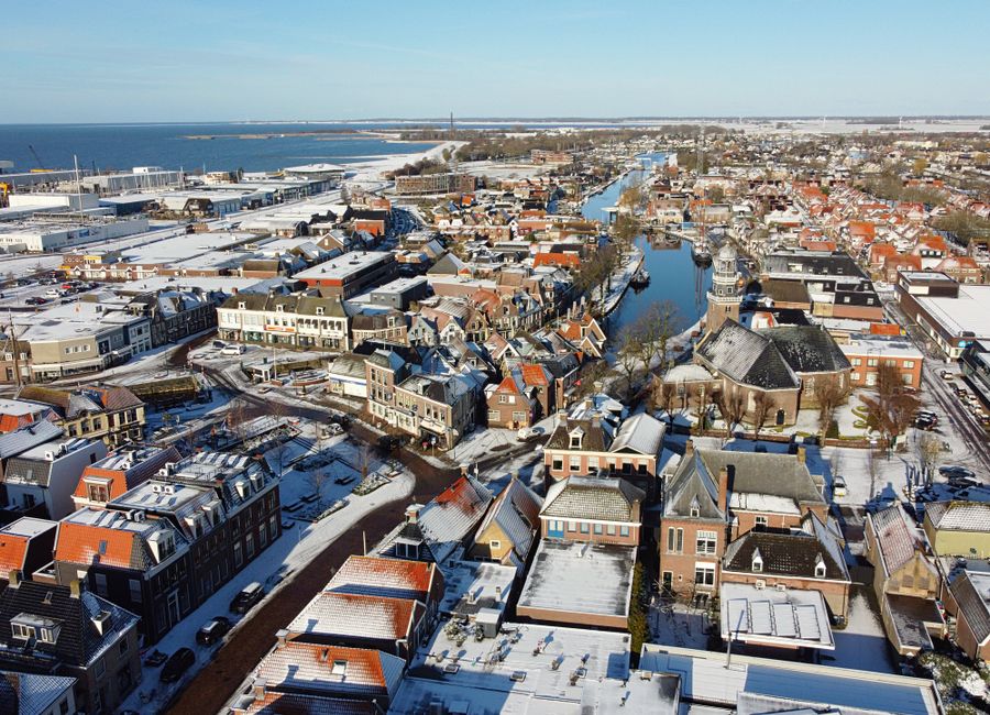 Snow-covered aerial view of the charming city of Lemmer in Friesland, Netherlands.