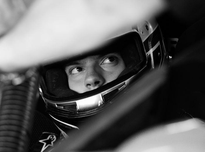 Helmeted competition driver, by Daniel on Pexels