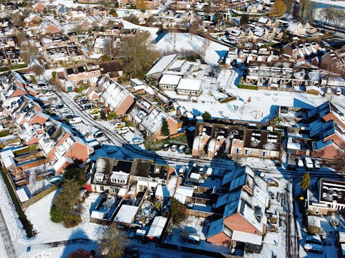 Aerial View of Houses Covered in Snow in a Residential Neighbourhood 