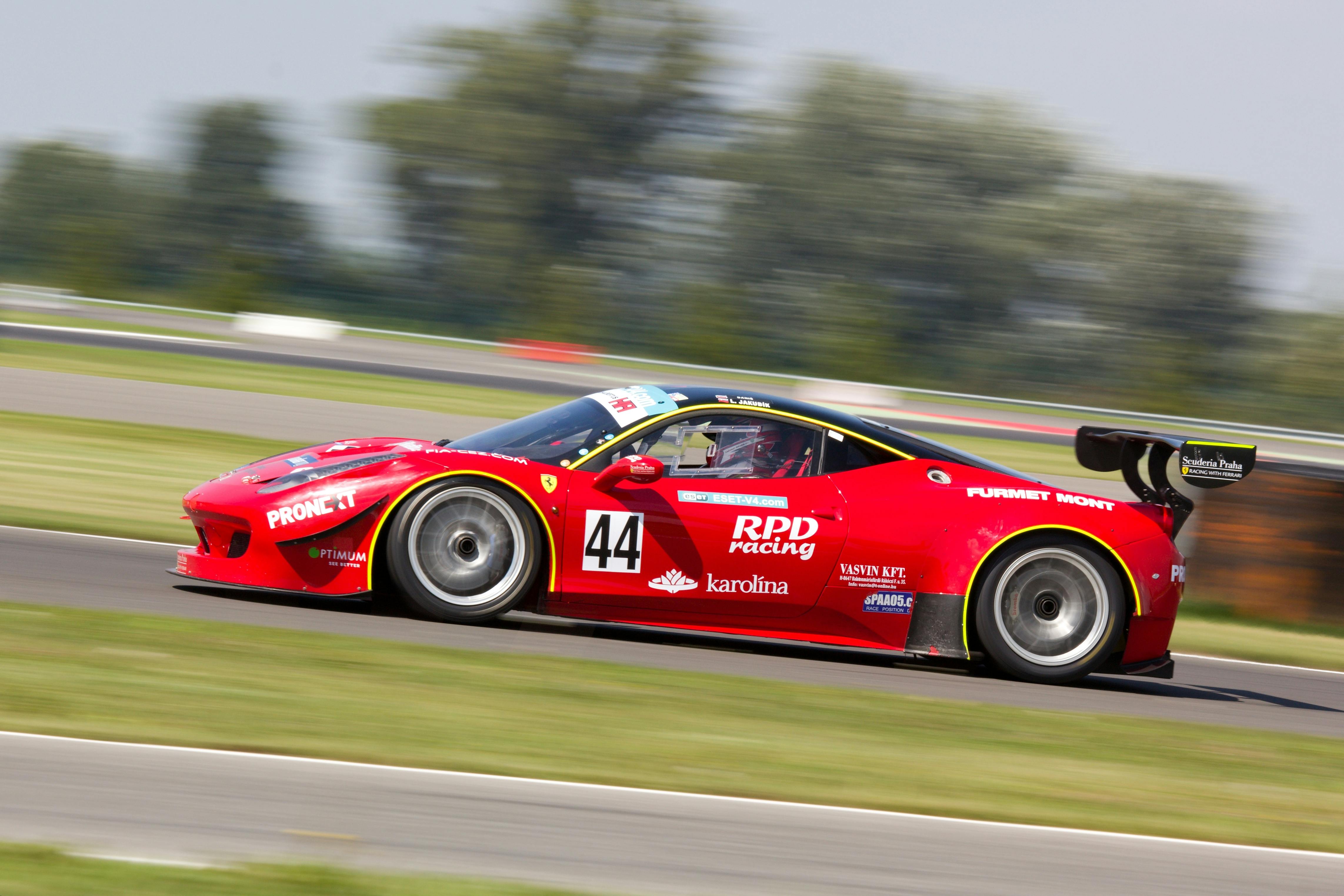 Red Racing Car on Race Track during Daytime \u00b7 Free Stock Photo