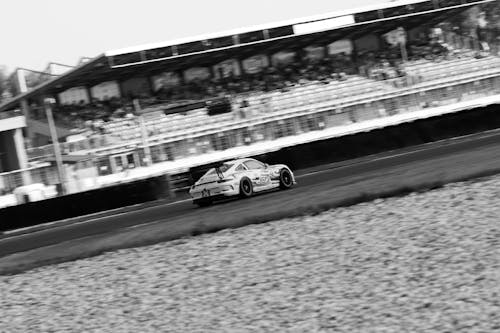 Grayscale Photo of Racing Car