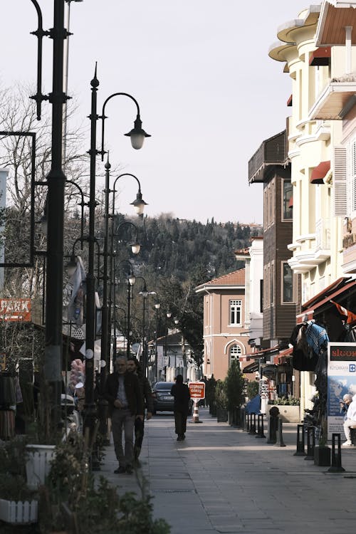 People Walking on Alley in Town