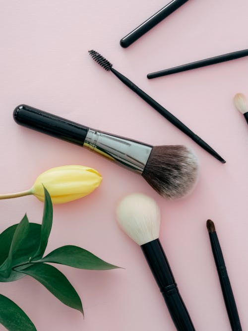 Photo of Makeup Brushes on Pink Background