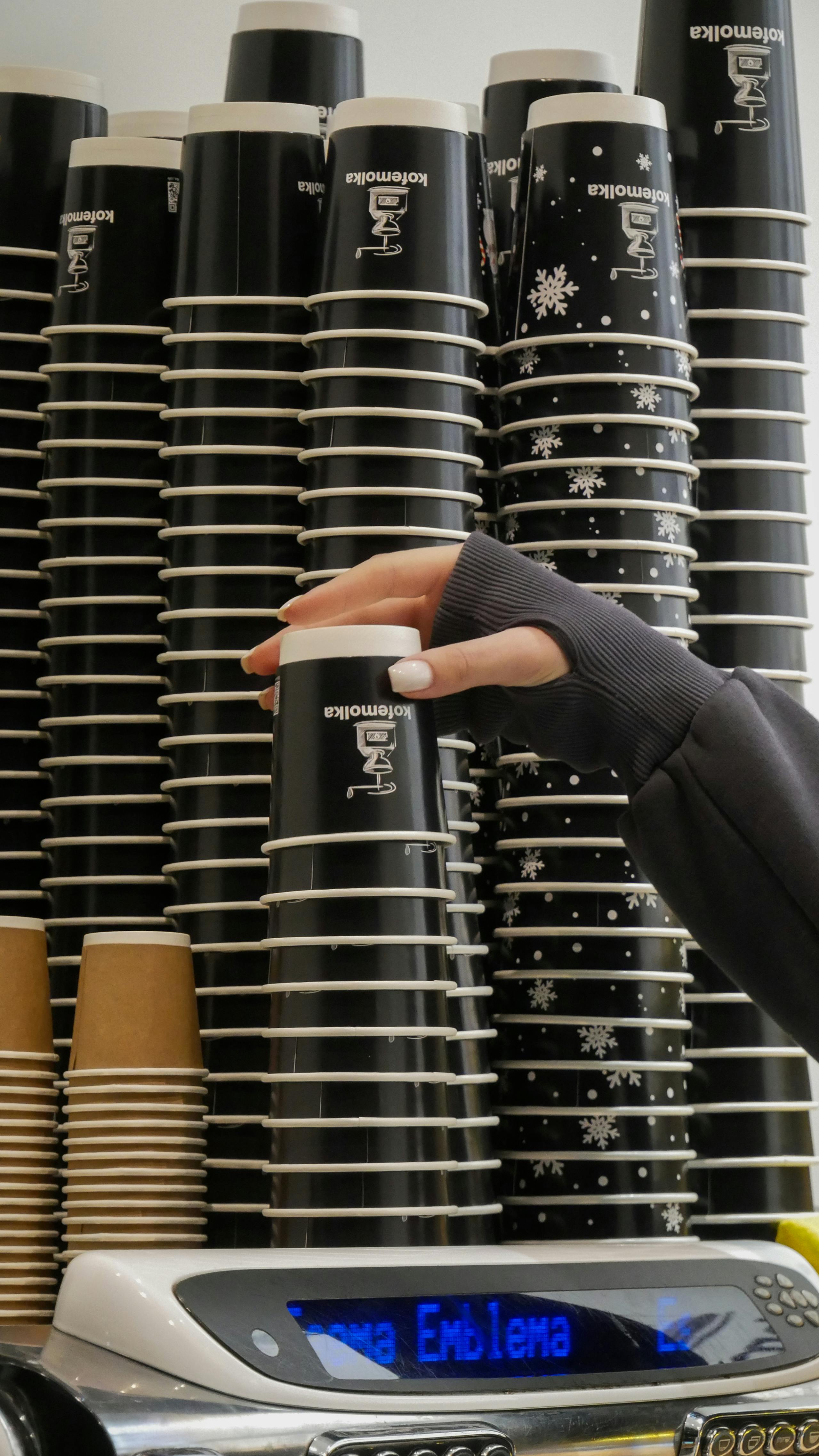 Hand Taking Paper Cup for Coffee in Cafe · Free Stock Photo