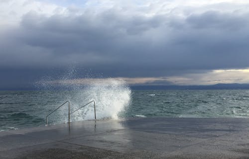 Sea Wave Crashing Against the Concrete Quay