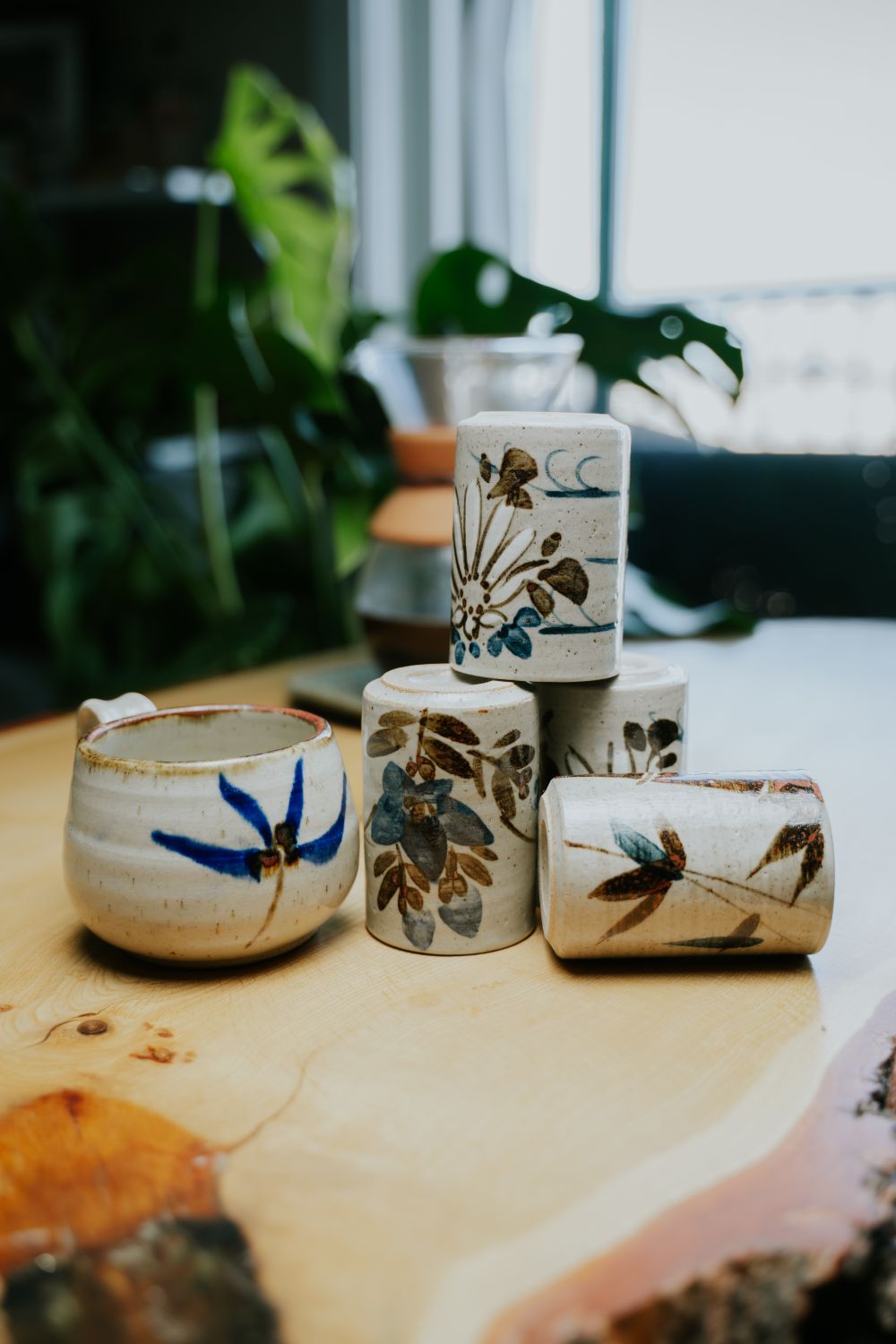 Set of Hand-painted Porcelain Mugs on a Table · Free Stock Photo