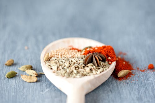 Assorted Seasoning in White Ceramic Spoon