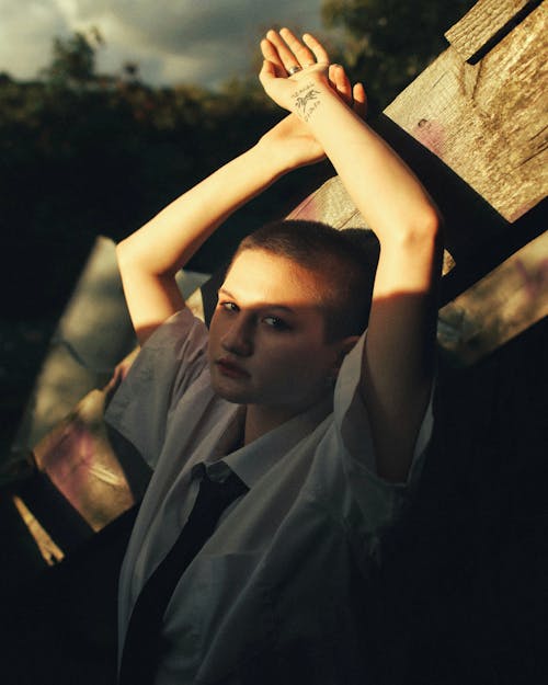 Young Woman with Short Hair Wearing a Shirt and Tie 