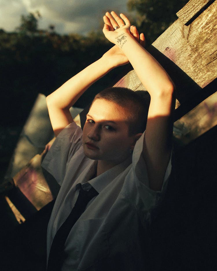 Young Woman With Short Hair Wearing A Shirt And Tie 