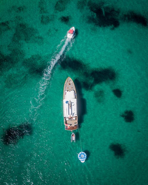 Aerial Photography of White and Brown Boat