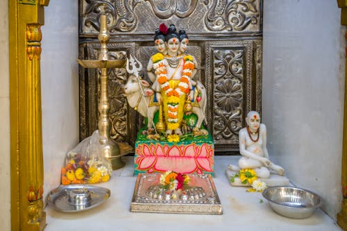 A statue of Lord Dattatreya at a Hindu temple for the festival of Datt Jayanti in Mumbai, India