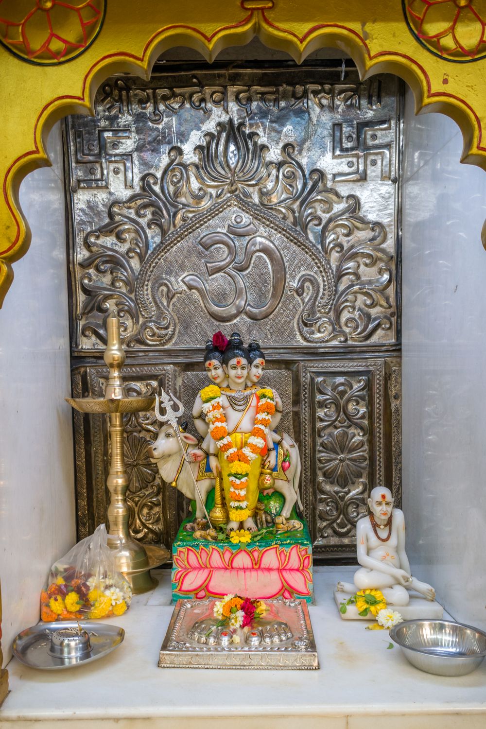 A statue of Lord Dattatreya at a Hindu temple for the festival of Datt ...