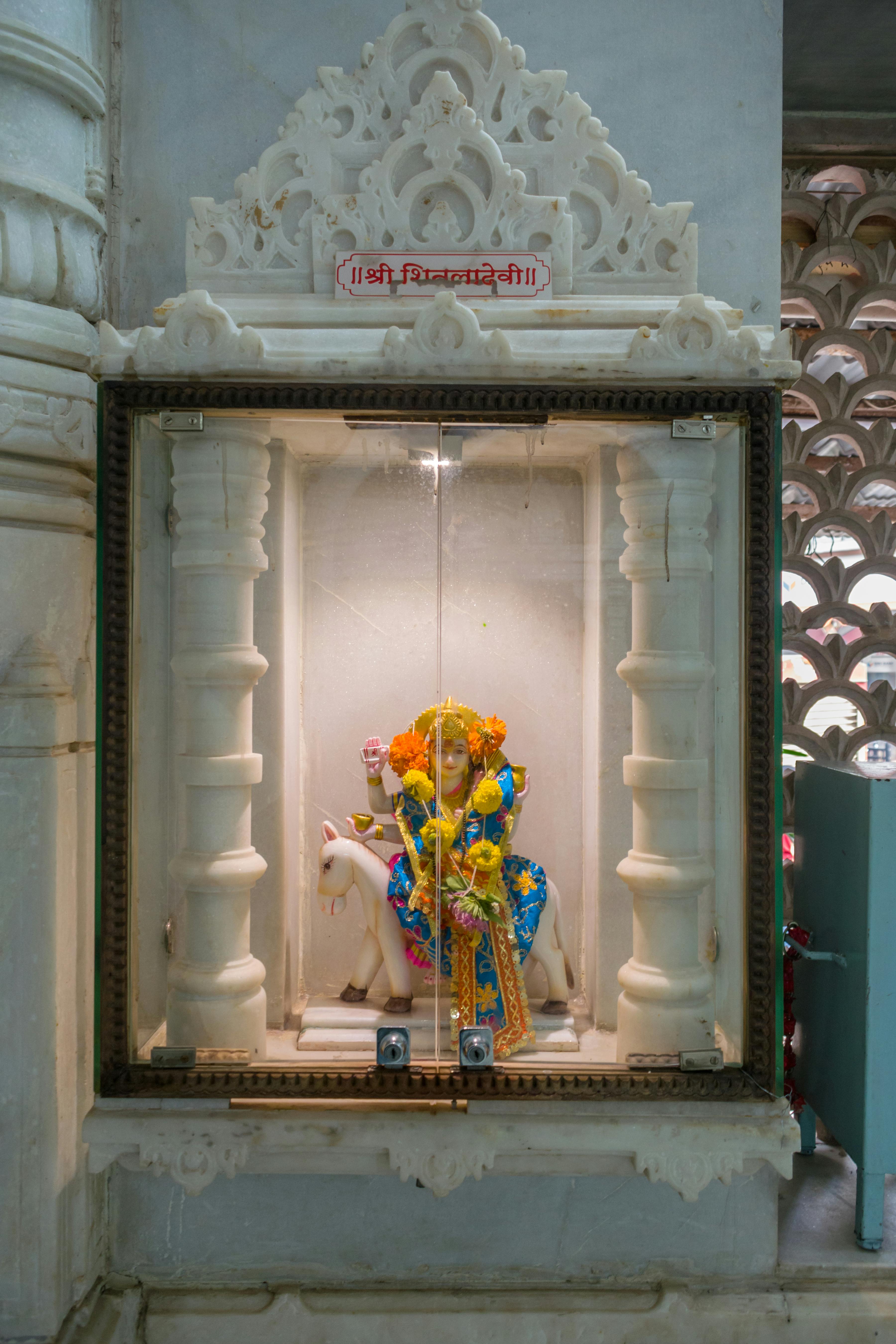 a beautiful idol of maa sitla being worshipped at a hindu temple in mumbai india