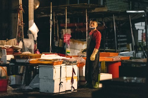 Butcher Selling Meat at Market