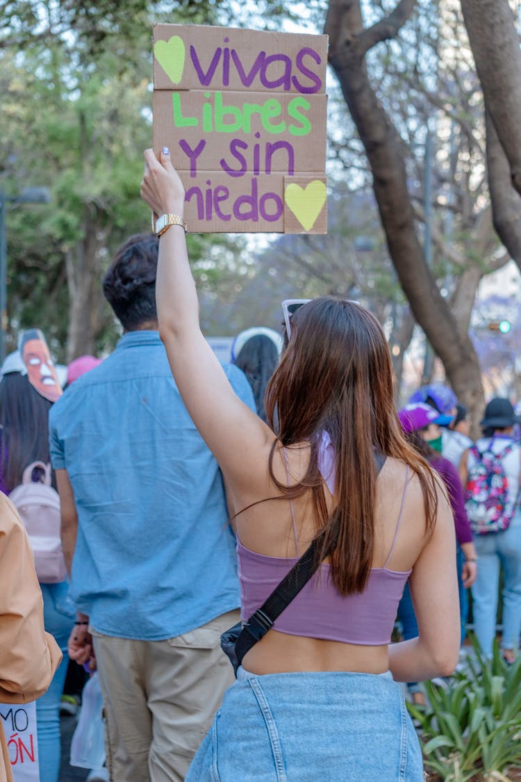 Young Woman With Banner Live Free And Without Fear