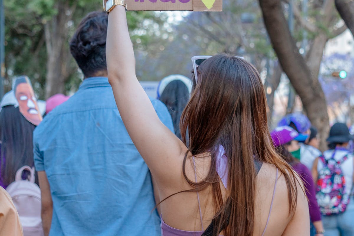 Woman holding a sign during a women's protest in Mexico City advocating for empowerment. Woman holding a sign during a women's protest in Mexico City advocating for empowerment.