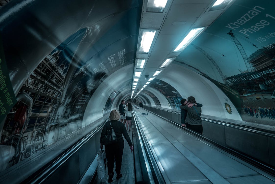 Blue Toned Image of a Subway Escalators in Perspective