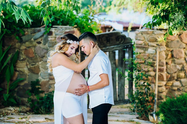 Man Holding Pregnant Woman's Belly