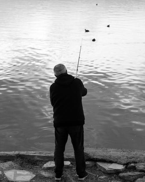 Man Holding a Fishing Rod